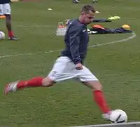 White man doing football training.