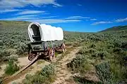 Covered wagon along a remnant of the Oregon Trail at the National Historic Oregon Trail Interpretive Center on Flagstaff Hill, Oregon