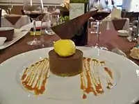 A dessert with a caramel sauce decoration on the plate