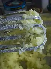 Butter being creamed using electric beaters