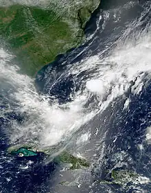 Satellite imagery showing a disorganized swirl of clouds off the coast of North Carolina.