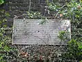 Plaque on retaining wall commemorating the Station's history