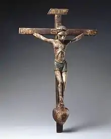 Image 29José Rafael Aragón, Crucifix, ca. 1795–1862, Brooklyn Museum, From about 1750, Catholic churches in Spanish New Mexico were increasingly decorated with the work of native craftspeople rather than with paintings, sculpture, and furniture imported from Europe. This small santo (religious image) is typical of the locally produced objects. It is made of indigenous pine and painted with water-based pigments used by native artisans. (from History of New Mexico)