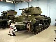 Photograph of a tank in a museum with a second similar tank in the background