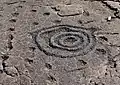 Cup and ring petroglyph in lava rock, island of Hawaii, US