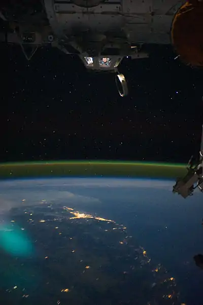 Cupola over the darkened Earth, in orbit in the vicinity of Brisbane, Australia