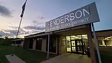 Front of the current Henderson ISD Administration building on Crosby Drive in Henderson, Tx at dusk.