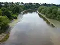 Same view in summer at low tide, looking down-river towards Curzon Park. The reduced water level is clearly visible.