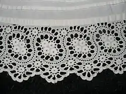 Petticoat with tucks above the cutwork border.