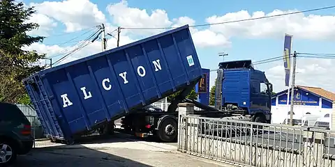 A roller container being offloaded