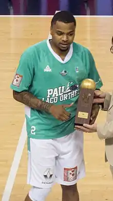 D. J. Cooper holding the MVP award trophy in 2017.