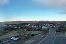 Drone photo, looking west towards the mountains, with the buildings of Harlowton in the foreground.