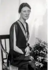 Black and white photograph of a seated woman