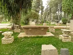 The museum's garden showcasing column capitals and an ancient tub