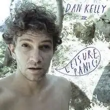 The main image is an upper body shot of the artist, who appears shirtless. He has a surprised, tired or annoyed look. In the background is a garden or beach-side scene with large plants, rocks and a body of water just visible over his right shoulder. The artist's name is written at top right in all capitals and bright purple script. Below in small script but same colour are the Roman numerals IV. In a cartoon-like speech bubble, near his open mouth, is the album's title in the same style script.