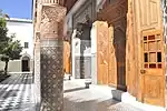 Columns of the courtyard (left) and wooden doors to the salons (right)