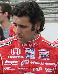 Dario Franchitti wearing red racing overalls with sponsors logos at the 2009 Indianapolis 500