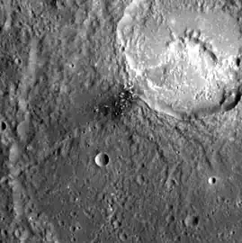 Detail of dark spot in Matisse crater.  Hollows are present in the dark spot and in Ngu Facula in the unnamed crater in upper right.