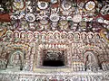 Cave 12. Phase II, after 650 AD. Yungang Grottoes, Datong: a riot of decoration is illustrated here, with Buddhas, musicians, and apsarasas.