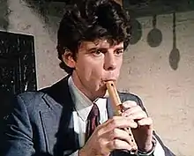 Munrow playing a six-holed pipe in 1976