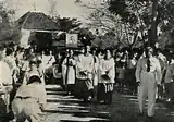 Rev. T.H.Huang leads the funeral procession at the Western Road Cemetery.