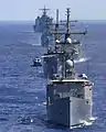 A SH-60 Seahawk helicopter preparing to land on the flight deck of USS Ingraham, leading the task force of Egyptian and Pakistan Navy during the Operation Bright Star in the Mediterranean Sea in 2005. Tariq is in the fourth row in front of USS Pearl Harbor, the last ship of this column.