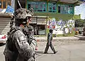 U.S. Army Staff Sgt. Michael Cruz of Cortland, New York, conducts a patrol with Afghan National Security Forces (ANSF) through the streets of Asadabad in August 2009.