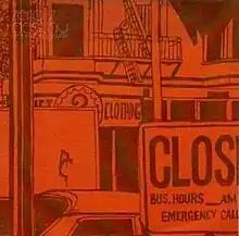 An orange-tinted image of an urban environment. In the background is a building with a fire escape, and below it, a sign with writing partially obscured by a lorry. The right half of the sign reads "CLOTHING". At the bottom right is a sign that reads, "CLOS— BUS. HOURS __ AM— EMERGENCY CALL—". In the top-left corner is faint writing that says, in two lines, "zero 7" and "destiny". Below it, in smaller font, is "featuring sia & sophie".