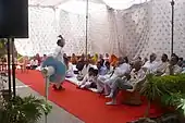 Another devotee dancing to Bavji's bhajan]