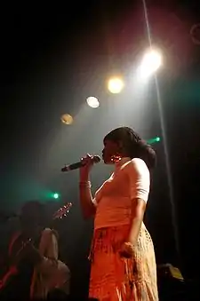 Dezarie singing on stage.