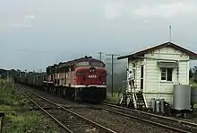 4479 and a 45 class haul a goods train about to exchange electric staffs at Fairy Hill, north of Casino, 1987