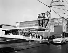 A black-and-white photograph of the Capitol Hill location of Dick's Drive-In, circa 1955.