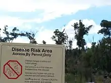 Warning sign near Mount Dale, Western Australia advising to keep vehicles out of dieback affected areas to prevent the spread of this fungus.