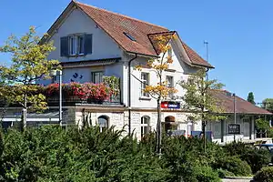 Three-story building with gabled roof