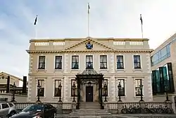 Image of building facade and associated car park.