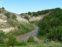 Small river running between steep banks