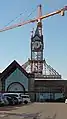 The clock tower being dismantled, which is now a 3D glass sphere, all in the centre court (April 1, 2014)