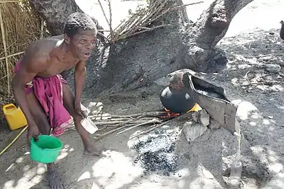 Distilling cashew apple liquor (muchekele) in Mozambique, southeastern Africa