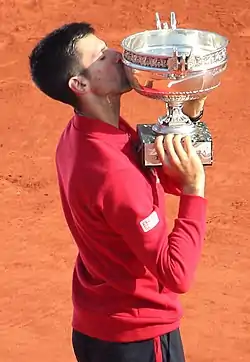 Image 9Novak Djokovic, the 2023 men's singles champion. It was his record-breaking twenty-third major title and his third at the French Open. (from French Open)