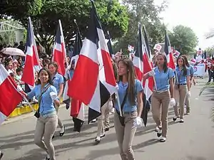 Dominicans with flag in Hermanas Mirabal province.