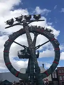 The Doomsday Destroyer thrill ride, with two mechanical arms rotating around a support structure.