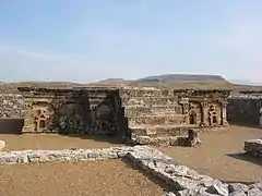 Stupa base at Sirkap, decorated with Hindu, Buddhist and Greek temple fronts.