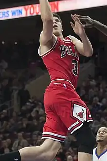 Doug McDermott scoring in a basketball game in 2014