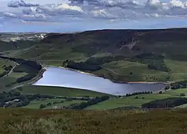 A lake deep in a valley surrounded by hills