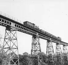 Dowery Dell Viaduct with steam train passing towards Longbridge