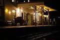 The station canopy (from Maghera railway station) and building lit up at night.