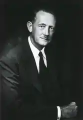 Dr. Willis Potts, dressed in a suit, smiling