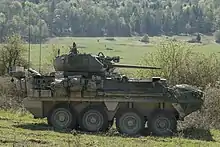 An Infantry Carrier Vehicle Dragoon (ICVD) from Ghost Troop, 2nd Squadron, 2nd Cavalry Regiment, over watches the engagement area from its battle position during the ICVD/Common Remote Weapons Station mounting a Javelin missile (CROWS-J) Operational Test at the Joint Maneuver Readiness Center (JMRC), Hohenfels, Germany