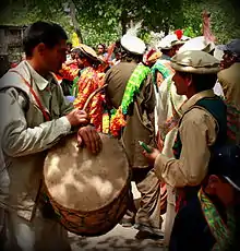 A drummer during the Joshi festival in Bumberet, Pakistan. Drumming is a male occupation among the Kalash people.