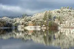 View across a calm Pine Mountain Lake toward the Dunn Court area